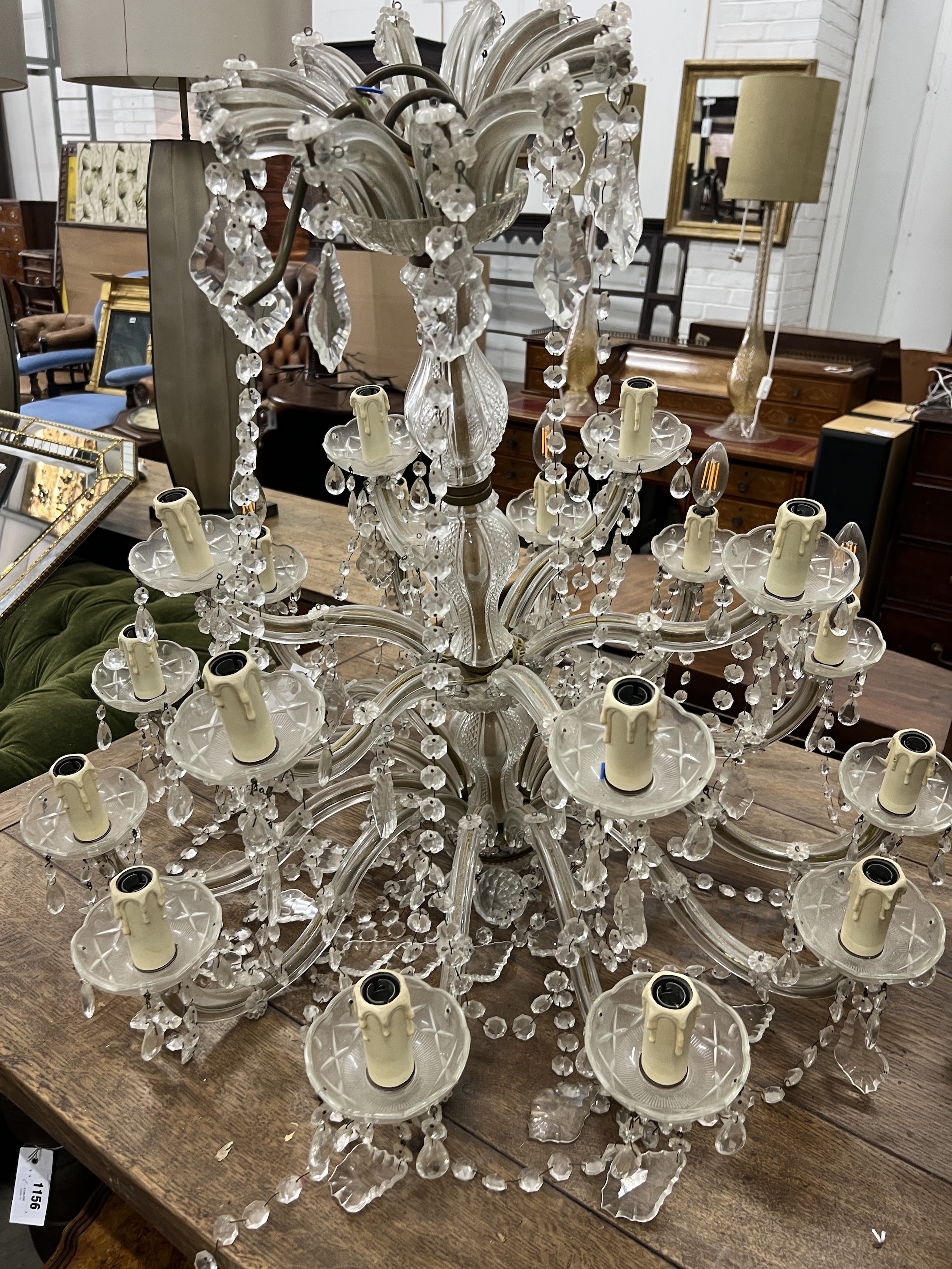 A moulded glass eighteen branch electrolier, hung circular and pear shaped faceted drops, height 56cm
